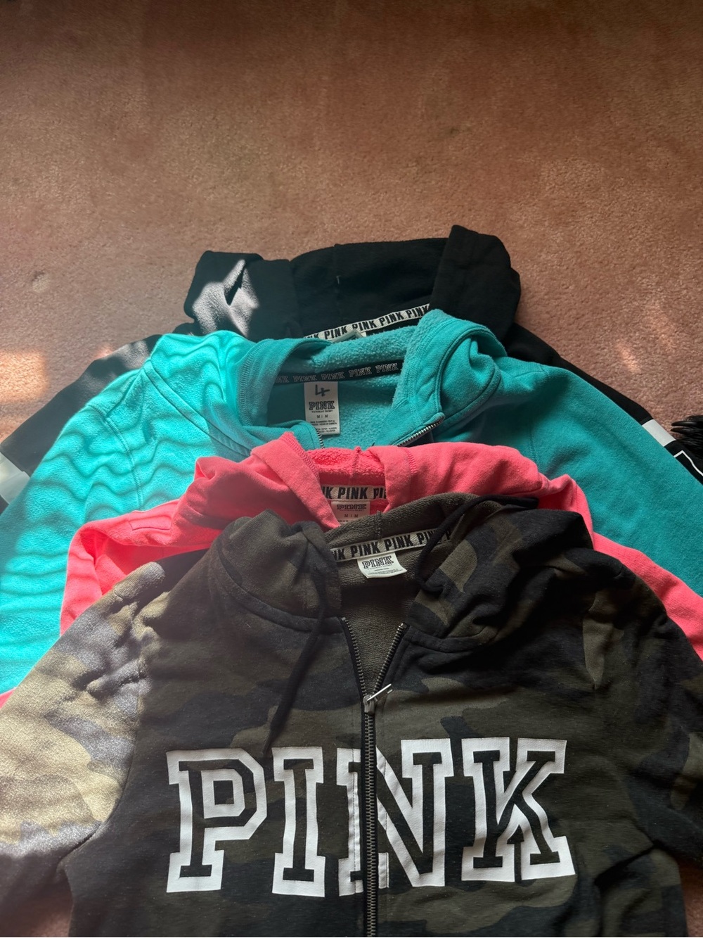 4 Pink brand zip up hoodies. Black, blue, pink and camo all in good shape - Picture 3 of 4